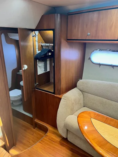Nola Yacht Photos Pics Interior of 2007 Tiara Yachts 3900 Sovran with wood finish and cozy seating area.