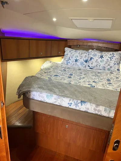 Nola Yacht Photos Pics Luxurious cabin interior of 2007 Tiara Yachts 3900 Sovran with cozy bedding.