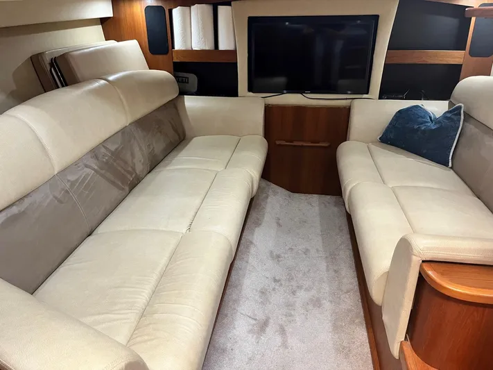 Nola Yacht Photos Pics Luxurious interior of 2007 Tiara Yachts 3900 Sovran with plush seating and TV.