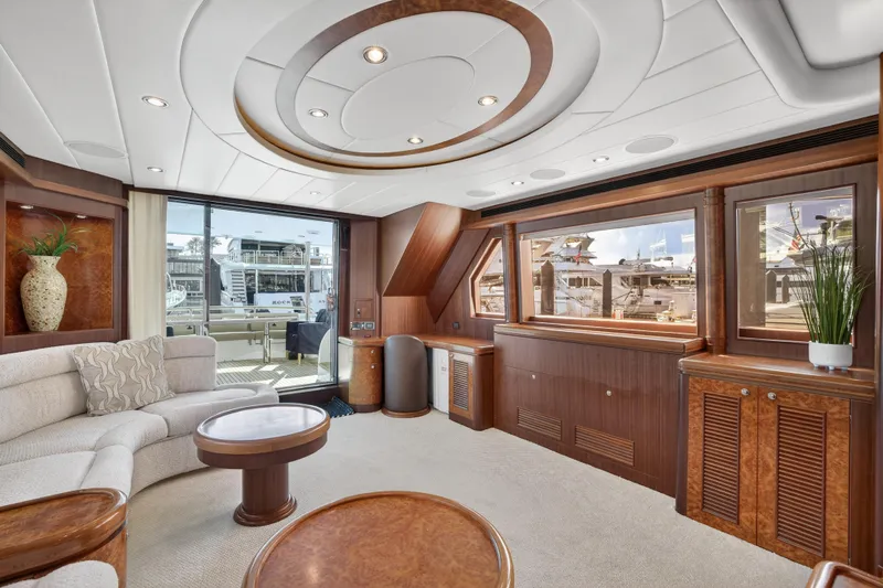 Arlene Yacht Photos Pics Luxurious 2009 Horizon Flybridge yacht interior with elegant wood finishes and plush seating.
