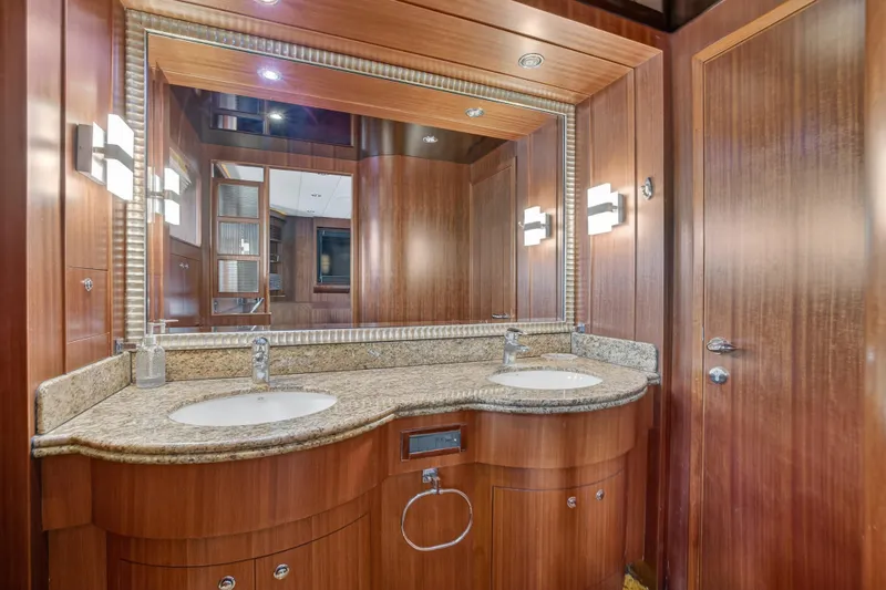 Arlene Yacht Photos Pics Luxurious wooden bathroom interior on 2009 Horizon Flybridge yacht with dual sinks and granite countertop.
