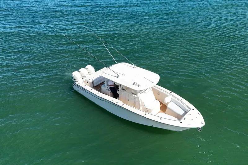  Yacht Photos Pics 2018 Grady-White Canyon 336 boat on clear blue water, aerial view.