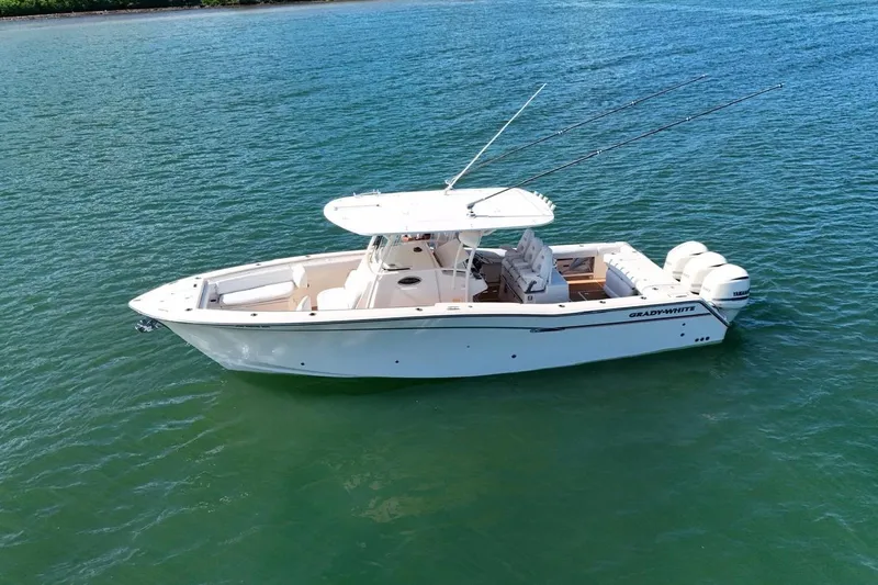  Yacht Photos Pics 2018 Grady-White Canyon 336 boat on calm blue water, aerial view.