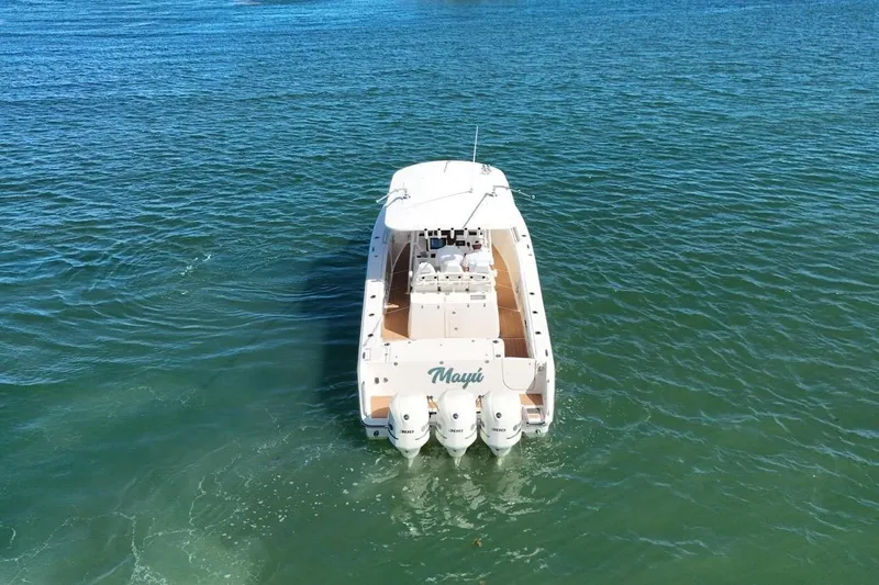  Yacht Photos Pics 2018 Grady-White Canyon 336 boat on open water, rear view.
