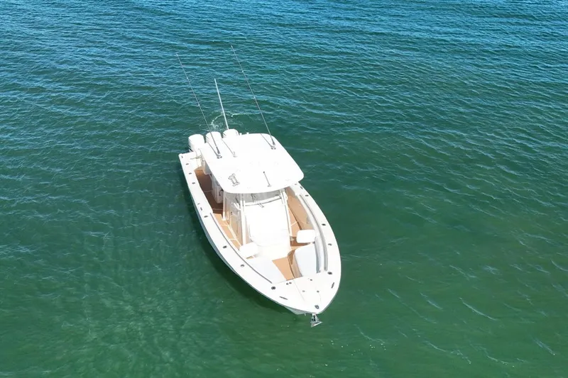  Yacht Photos Pics 2018 Grady-White Canyon 336 boat on calm blue water.