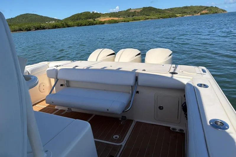  Yacht Photos Pics 2018 Grady-White Canyon 336 boat with triple engines on a scenic lake.