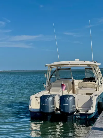 Daddy's Broke Lll Yacht Photos Pics 2020 Grady-White Canyon 306 boat with twin Yamaha engines on calm water.