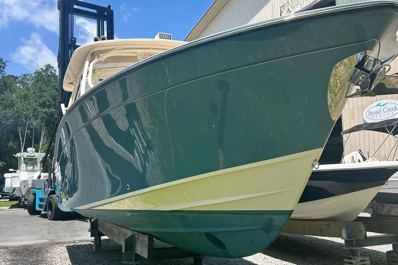 Daddy's Broke Lll Yacht Photos Pics 2020 Grady-White Canyon 306 boat displayed at marina, sunny day.