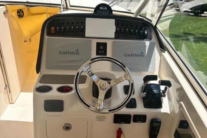 Daddy's Broke Lll Yacht Photos Pics Grady-White Canyon 306 helm with Garmin electronics, 2020 model.