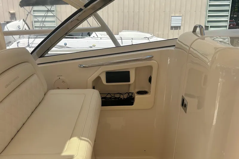 Daddy's Broke Lll Yacht Photos Pics Interior of 2020 Grady-White Canyon 306 boat, featuring seating and storage compartments.