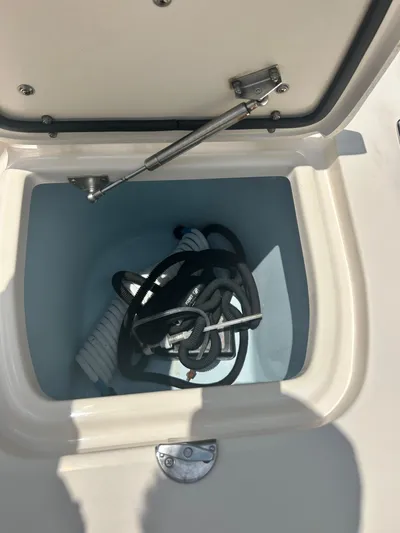 Daddy's Broke Lll Yacht Photos Pics Storage compartment on a 2020 Grady-White Canyon 306 boat with coiled ropes inside.