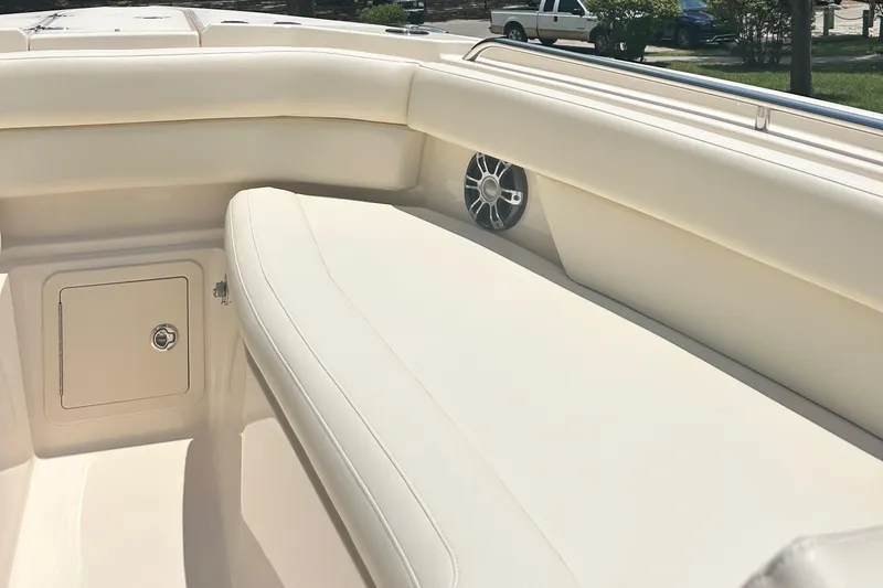 Daddy's Broke Lll Yacht Photos Pics 2020 Grady-White Canyon 306 boat interior with cushioned seating and speaker.