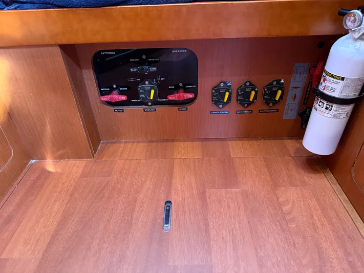 Overkill Yacht Photos Pics Beneteau Oceanis 48 2016 control panel with fire extinguisher.