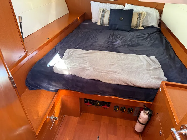 Overkill Yacht Photos Pics Beneteau Oceanis 48 cabin, 2016 model, featuring a cozy bed.