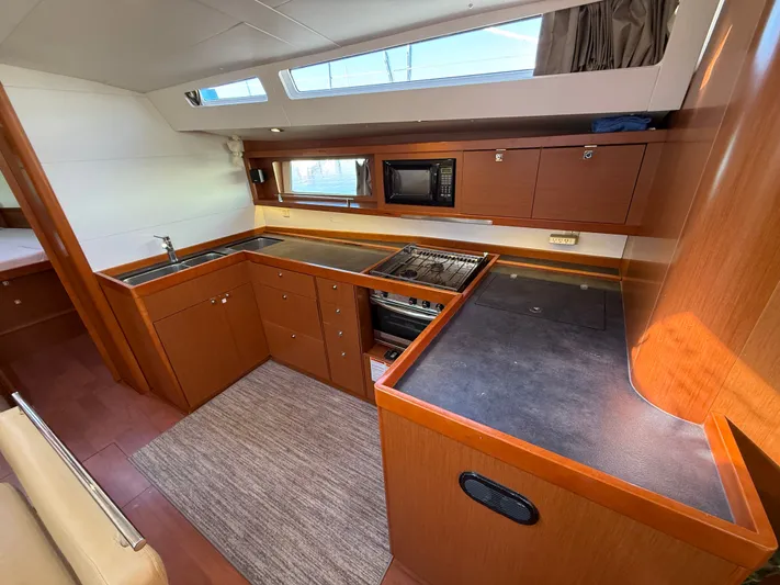 Overkill Yacht Photos Pics Interior view of a 2016 Beneteau Oceanis 48 yacht kitchen.