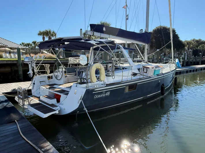 Overkill Yacht Photos Pics 2016 Beneteau Oceanis 48 sailboat docked in harbor.