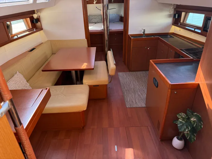 Overkill Yacht Photos Pics Interior of 2016 Beneteau Oceanis 48 yacht with modern kitchen and dining area.