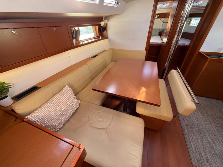 Overkill Yacht Photos Pics Interior of 2016 Beneteau Oceanis 48 yacht with cozy seating area.