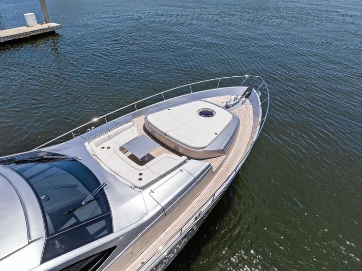 Phoenix Rising Yacht Photos Pics 2017 Pershing 82 yacht on water, showcasing sleek design and spacious deck.