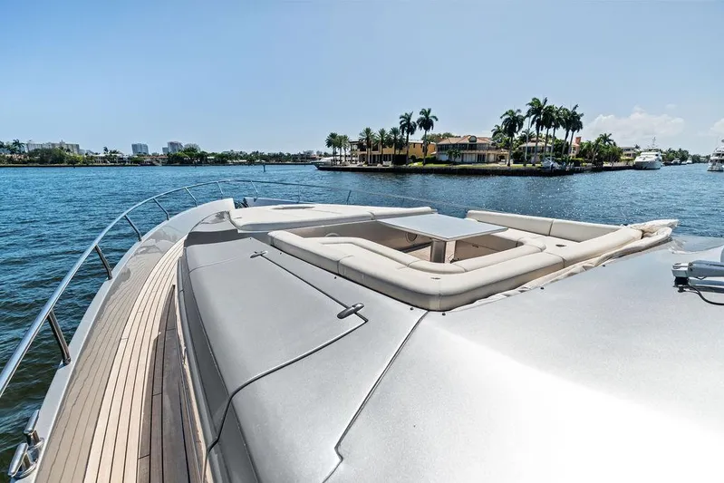 Phoenix Rising Yacht Photos Pics Luxurious 2017 Pershing 82 yacht with spacious deck and scenic waterfront view.
