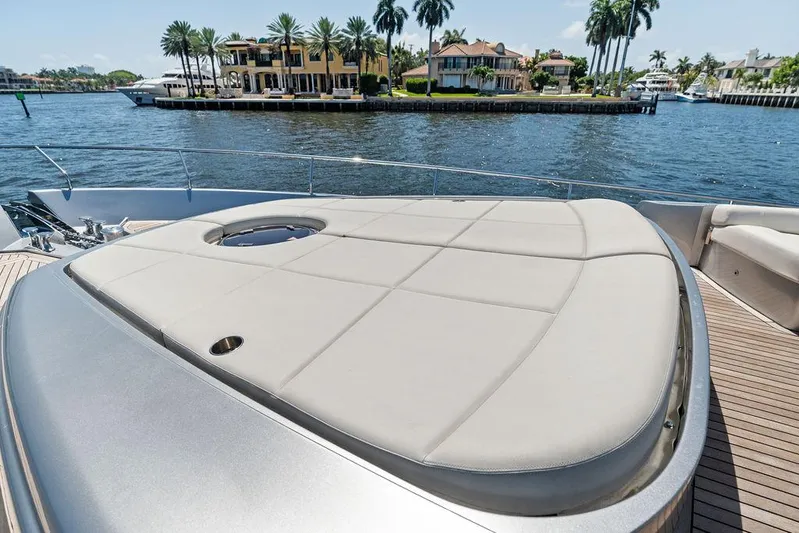 Phoenix Rising Yacht Photos Pics Luxurious 2017 Pershing 82 yacht with spacious sunbathing deck, docked near waterfront homes.