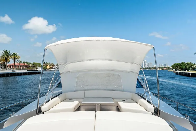 Phoenix Rising Yacht Photos Pics 2017 Pershing 82 yacht with sunshade, cruising on a sunny day.