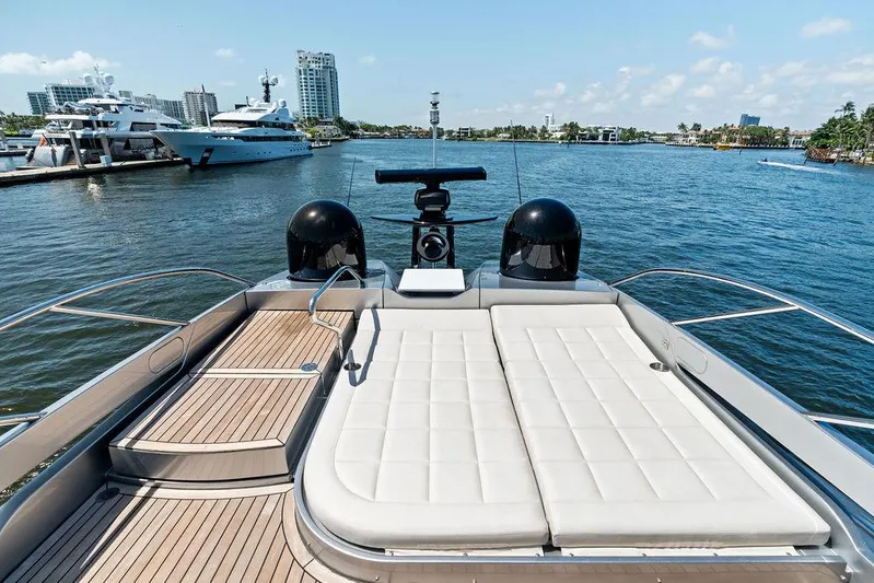 Phoenix Rising Yacht Photos Pics Luxurious 2017 Pershing 82 yacht with sunbathing deck, docked in a scenic marina.