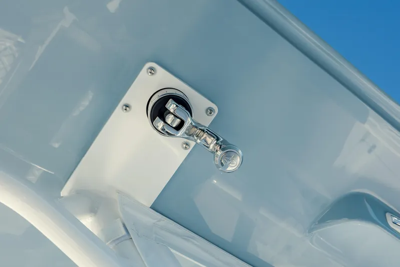  Yacht Photos Pics Close-up of a 2025 Yellowfin 32 boat component against a blue sky.