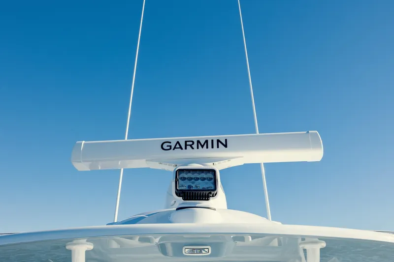  Yacht Photos Pics 2025 Yellowfin 32 boat with Garmin radar against clear blue sky.