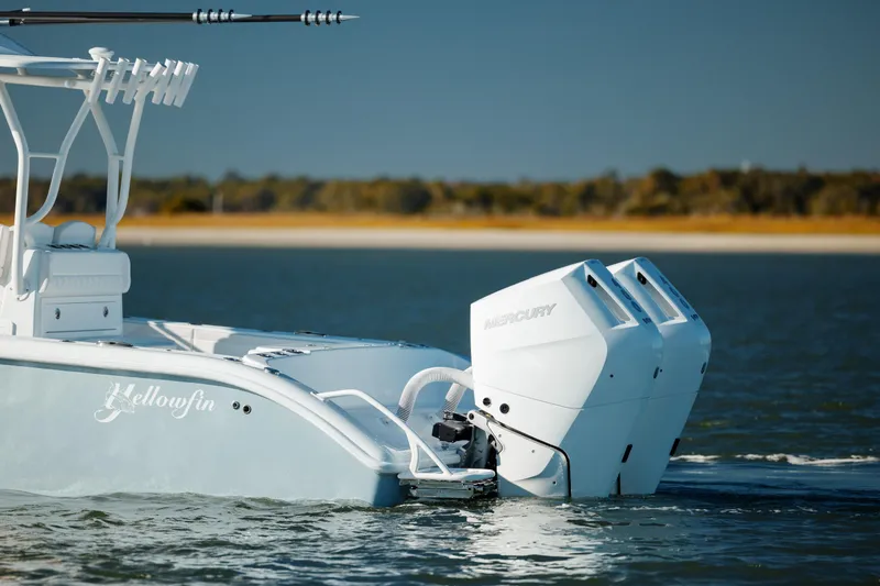  Yacht Photos Pics 2025 Yellowfin 32 boat with dual outboard motors on water.
