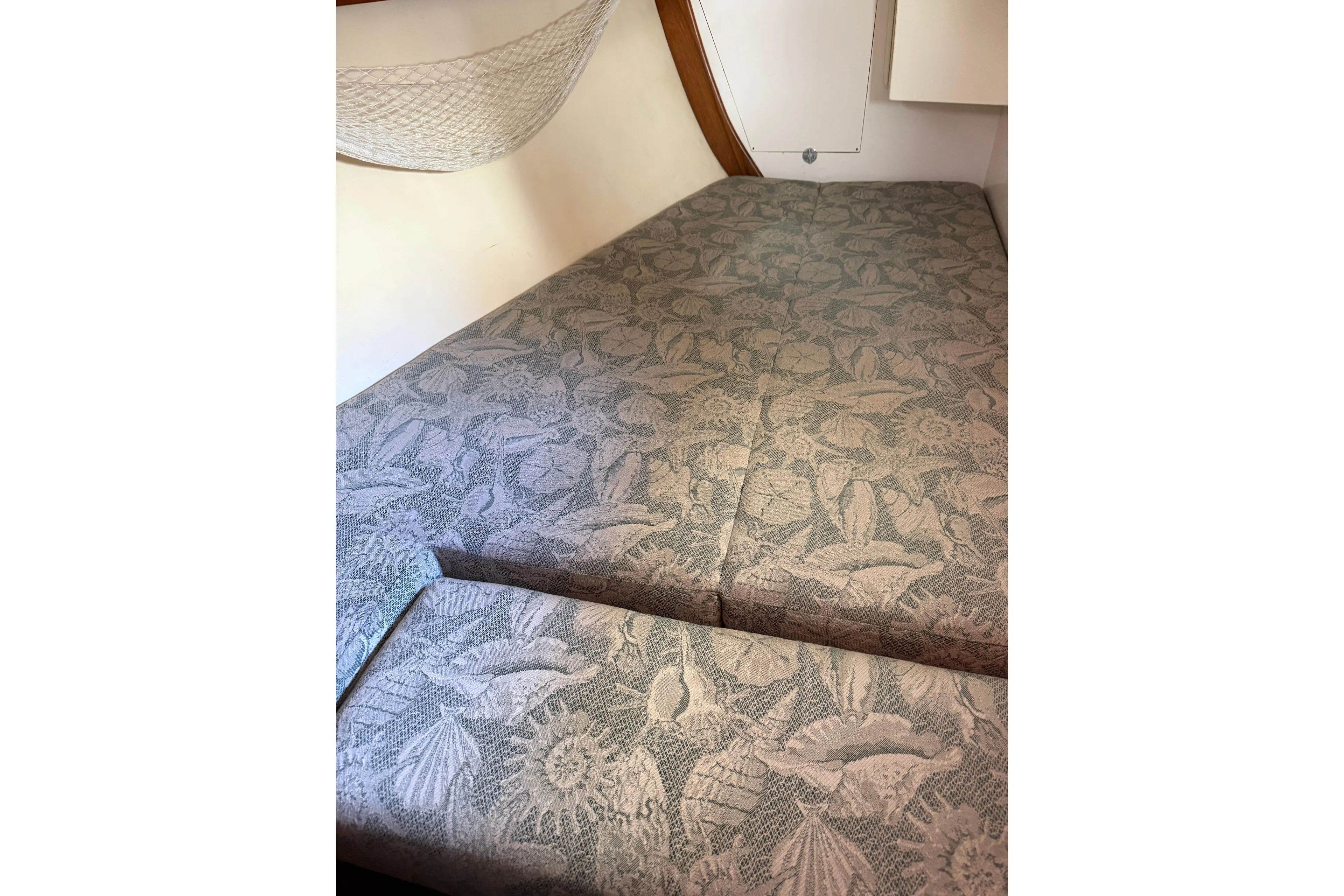 Via Yacht Photos Pics Cushioned sleeping area in 2004 Caliber 40LRC boat with floral-patterned upholstery.