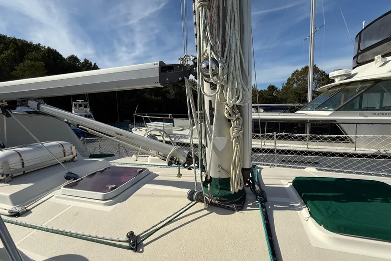 Via Yacht Photos Pics 2004 Caliber 40LRC sailboat deck with rigging and equipment in marina.