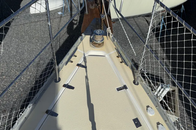 Via Yacht Photos Pics Bow of 2004 Caliber 40LRC sailboat with safety netting and winch.