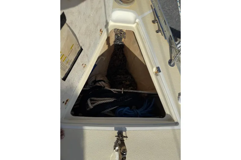 Via Yacht Photos Pics Open storage compartment on 2004 Caliber 40LRC sailboat, containing ropes and equipment.