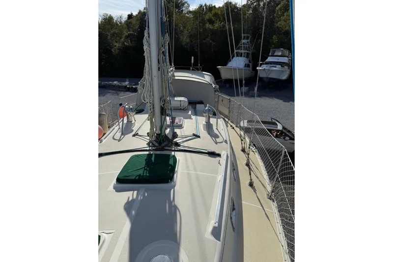 Via Yacht Photos Pics 2004 Caliber 40LRC sailboat deck with rigging, docked near other boats.