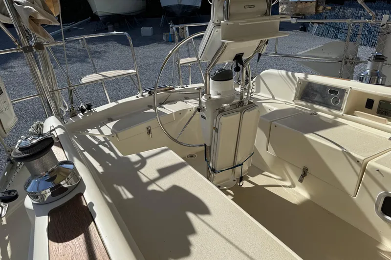 Via Yacht Photos Pics 2004 Caliber 40LRC sailboat cockpit with steering wheel and navigation equipment.