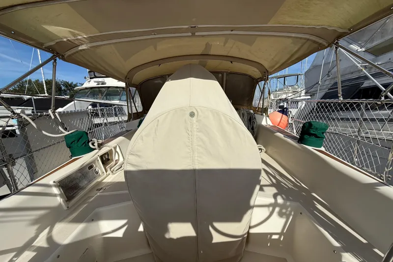 Via Yacht Photos Pics 2004 Caliber 40LRC sailboat cockpit with covered wheel, docked at marina.