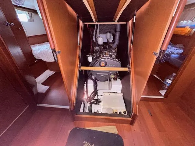  Yacht Photos Pics Engine compartment of 2016 Beneteau Oceanis 45 sailboat, showcasing interior layout.