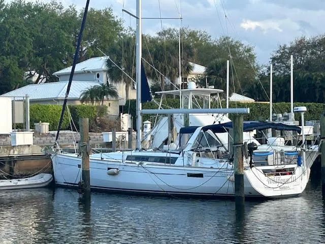 Yacht Photos Pics 2016 Beneteau Oceanis 45 sailboat docked in a marina setting.