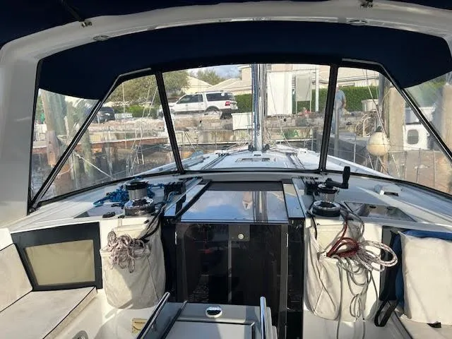  Yacht Photos Pics Beneteau Oceanis 45 cockpit, 2016 model, featuring navigation equipment and protective canopy.