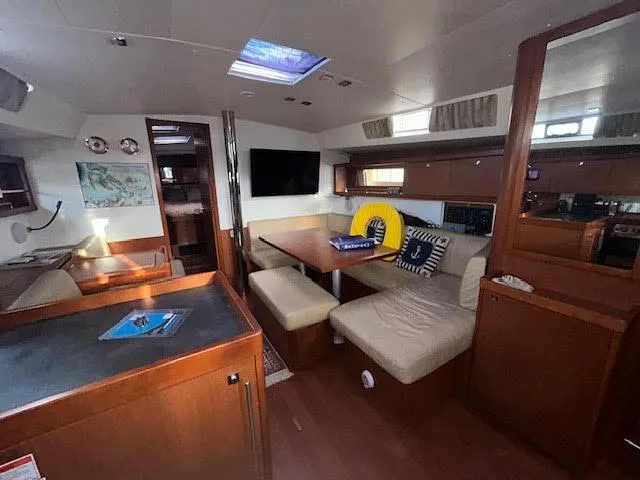  Yacht Photos Pics Interior of 2016 Beneteau Oceanis 45 yacht with cozy seating and modern amenities.