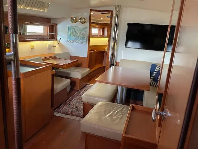  Yacht Photos Pics Interior of 2016 Beneteau Oceanis 45 yacht, featuring cozy seating and modern amenities.