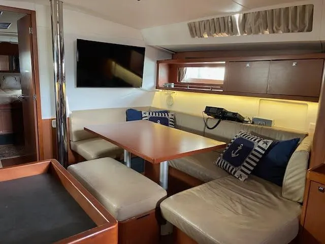  Yacht Photos Pics Interior of 2016 Beneteau Oceanis 45 yacht with cozy seating and modern amenities.