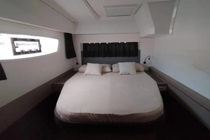  Yacht Photos Pics Luxurious bedroom interior of 2021 Fountaine Pajot Catamaran Astrea 42 with modern design.