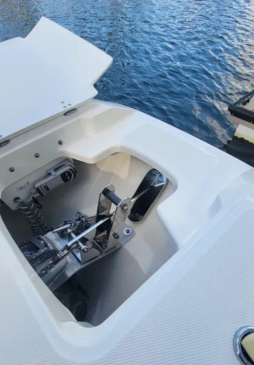 Yacht Photos Pics 2021 Boston Whaler 320 Vantage anchor compartment by the water.