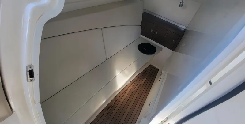  Yacht Photos Pics Interior cabin of 2021 Boston Whaler 320 Vantage with wood flooring and seating.