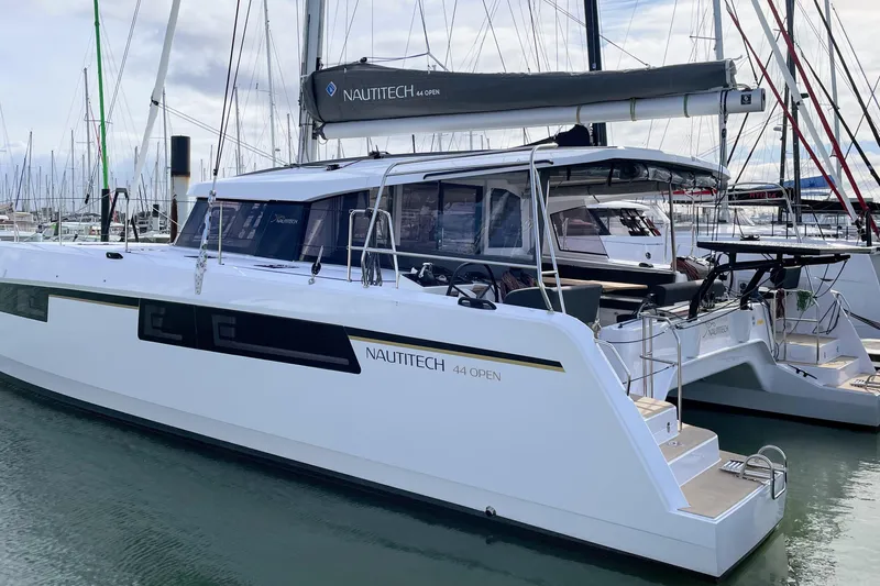  Yacht Photos Pics 2022 Nautitech 44 Open catamaran docked in a marina, showcasing sleek design and modern features.