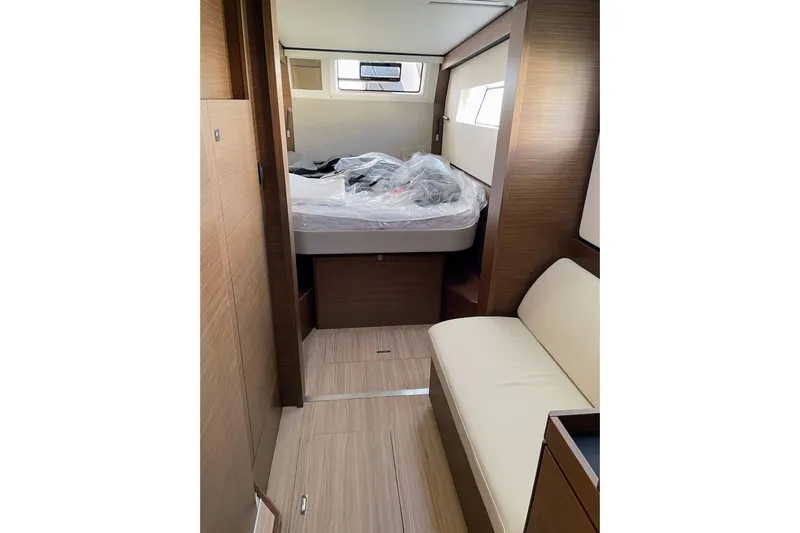  Yacht Photos Pics Interior of 2022 Nautitech 44 Open yacht cabin with bed and seating area.