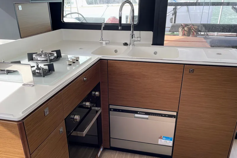  Yacht Photos Pics Modern kitchen in 2022 Nautitech 44 Open yacht with stove, sink, and dishwasher.
