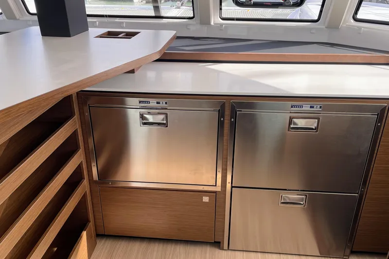  Yacht Photos Pics Modern kitchen area in 2022 Nautitech 44 Open yacht with stainless steel appliances.